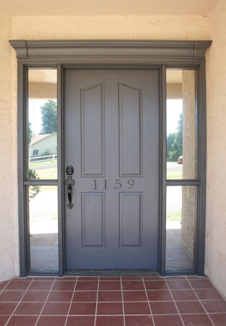 the front door to a home with tiled flooring