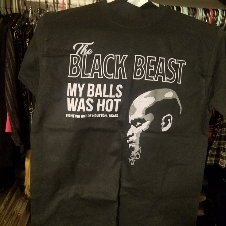 the black beast t - shirt is hanging on a rack