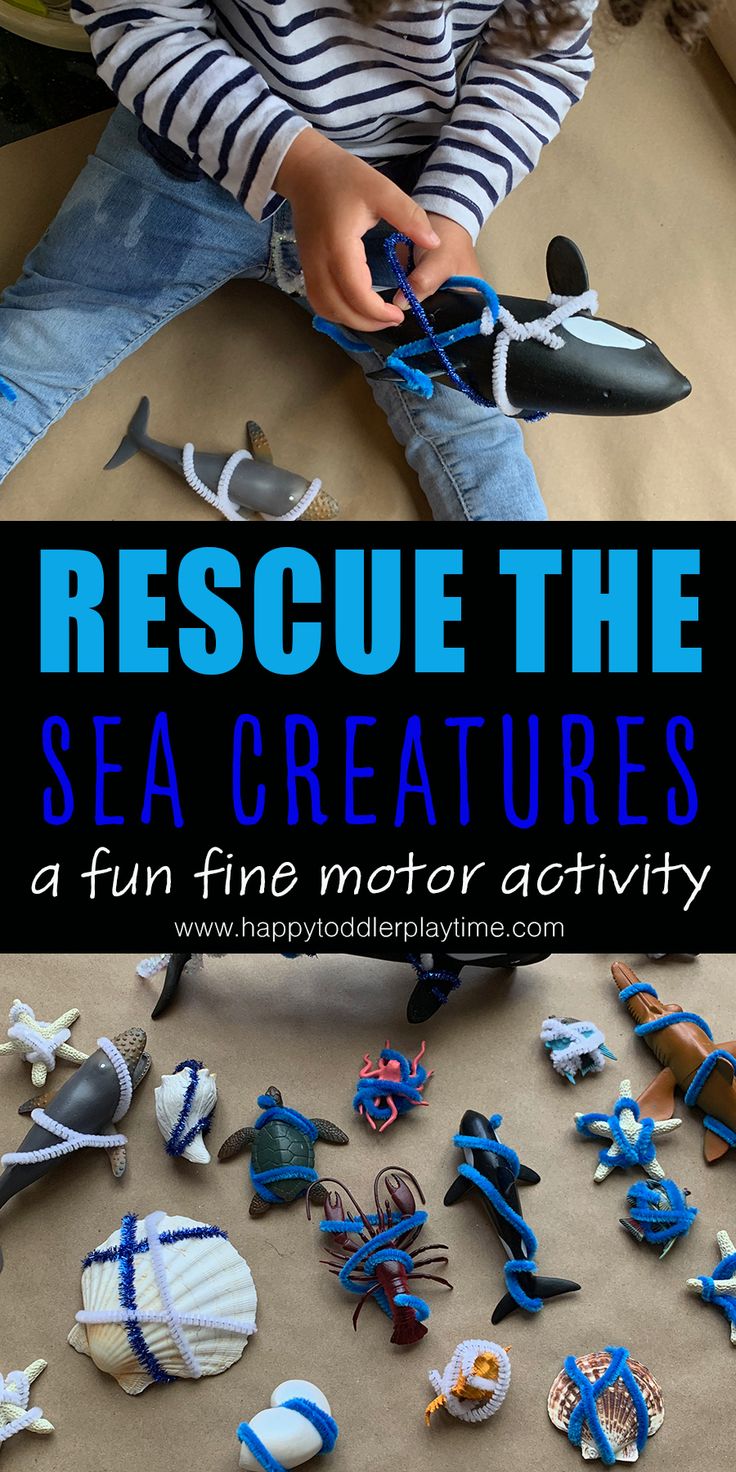 a young boy playing with sea creatures and making them look like they are in the ocean