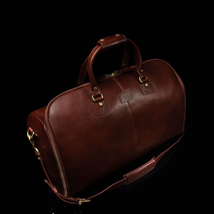 Pack everything you need into this multifunctional leather garment weekender bag that comfortably gets you anywhere you need to go - that's the Grand. The outstanding quality of this premium holdall is a real workhorse for your most elegant attire. Its functional yet classy design is perfect for traveling abroad, overnight stays, and even those early morning yoga or pilates sessions. Made from full-grain vegetable-tanned cow leather, it is guaranteed to last you for years to come. The leather, a Work Backpack Women, Garment Duffle Bag, Leather Garment Bag, Early Morning Yoga, Mens Card Wallet, Leather Gifts For Her, Travelling Abroad, Personalized Travel Bag, Mens Leather Accessories