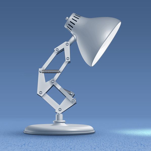 a white desk lamp sitting on top of a table