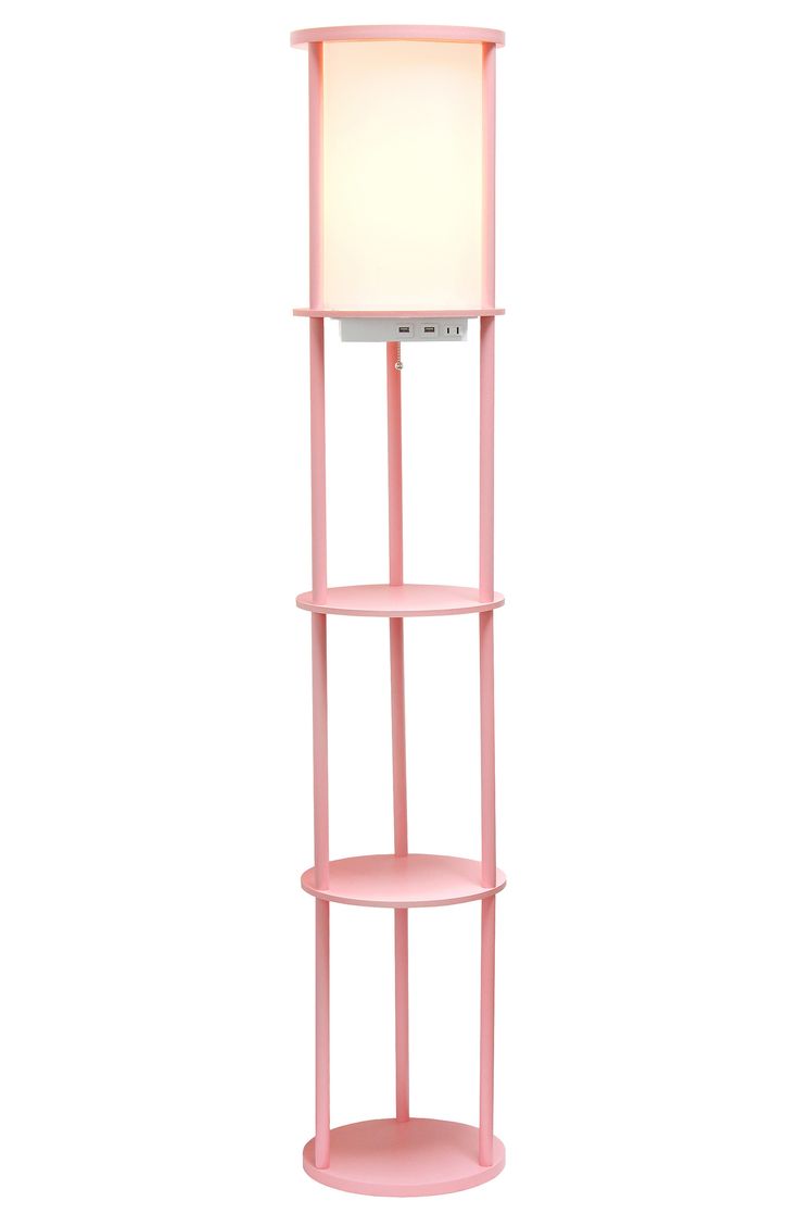 a pink shelf with a lamp on top and a white light in the corner next to it