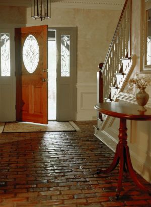 an entry way with a table and stairs