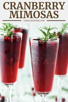 cranberry mimosas with rosemary garnish in glasses