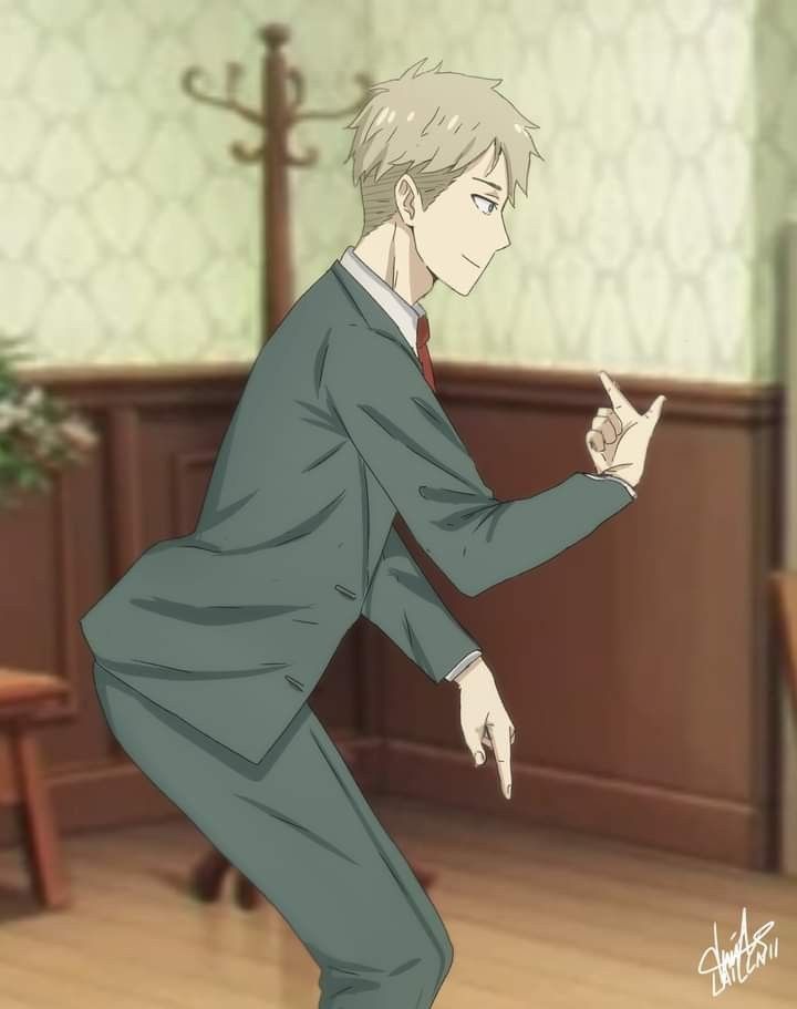 a man in a suit and tie pointing at something on the floor with one hand