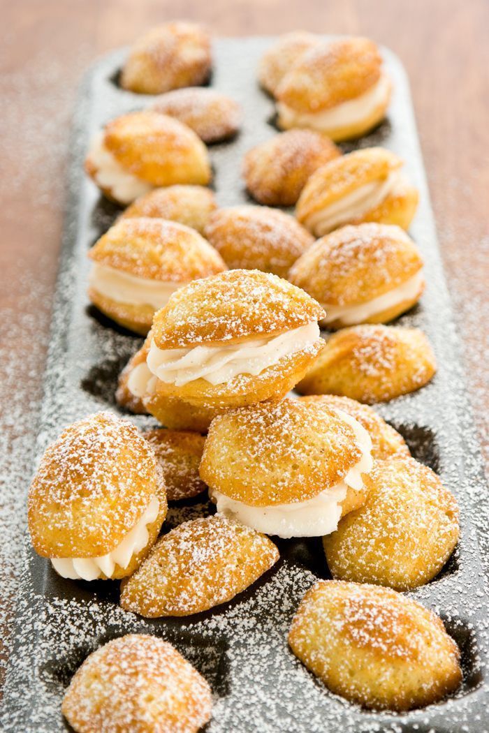 small pastries are lined up on a tray