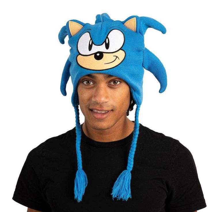 Embrace the world of Sonic the Hedgehog with this officially licensed Sonic Cosplay Laplander Beanie. Designed for fans of all ages, this beanie captures the spirit of Sonic's character with a big face design that includes 3D quills crafted from cut fabric and flat embroidery. Whether you're a dedicated cosplayer or simply want to showcase your Sonic fandom, this beanie is the perfect accessory. Made from high-quality acrylic yarn, it provides both warmth and comfort, making it suitable for cold Blue Novelty Costume Accessories For Cosplay, Novelty Beanie For Cosplay, Novelty Beanie Hat For Cosplay, Novelty Winter Costume Hats And Headpieces, Sonic Cosplay, Big Face, Face Design, The Hedgehog, Acrylic Yarn