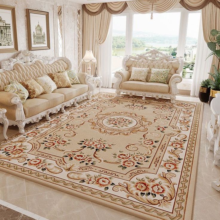 a living room filled with furniture and a large rug