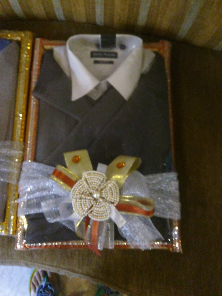 two boxes with ties and other items in them