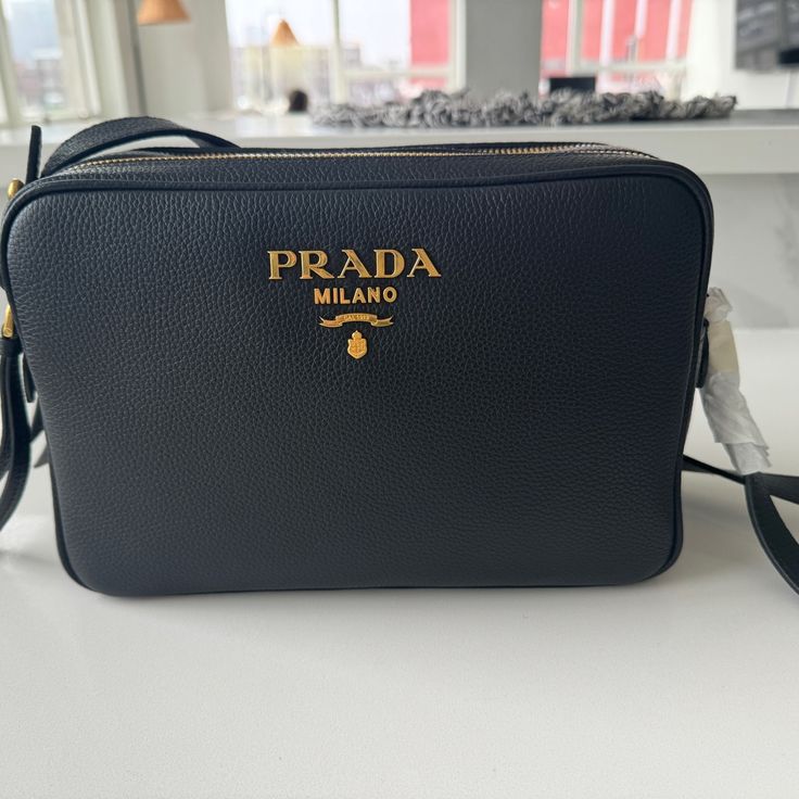 Black Crossbody Bag - Brand New With Tags Length - 9.25��” Width - 3” Height - 6.25” Black Shoulder Bag With Logo Plaque, Black Evening Bag With Logo Plaque, Black Travel Bags With Logo Plaque, Black Rectangular Bag With Logo Plaque, Black Business Bag With Logo Plaque, Black Bag With Logo Plaque, Luxury Black Shoulder Bag With Logo Plaque, Luxury Crossbody Bag With Logo Plaque, Luxury Formal Bag With Logo Plaque