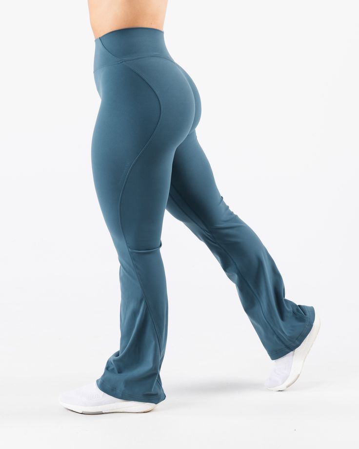 HIGHLIGHTS. Sculpting seamlines Buttery soft hand feel High Stretch Flared leg Sizes XXS - M: 31" inseam Sizes L - XXL: 32.5" inseam FIT SUGGESTION. This item runs true to Alphalete's standard sizing.. We recommend sizing up for a more relaxed fit or down for a more compressive fit.. Model is 5’2”/157.5cm, wearing a size. S. with 39"/99cm hips and 28”/71.1cm waist. MATERIALS AND WASHING DIRECTIONS. 75%. Nylon,. 25%. Spandex. We recommend washing inside-out on a cold setting. Hang to dry DESCRIPT Sporty Flare Pants For Loungewear, Sporty Flare Lounge Pants, Compressive High-cut Leg Elastane Pants, Athleisure Flare Pants For Loungewear, Fitted Wide Leg Activewear For Loungewear, Fitted Wide Leg Loungewear Activewear, Blue Flare Pants In Elastane, Blue Flare Pants With Elastane, High Stretch Solid Color High-cut Leg Pants