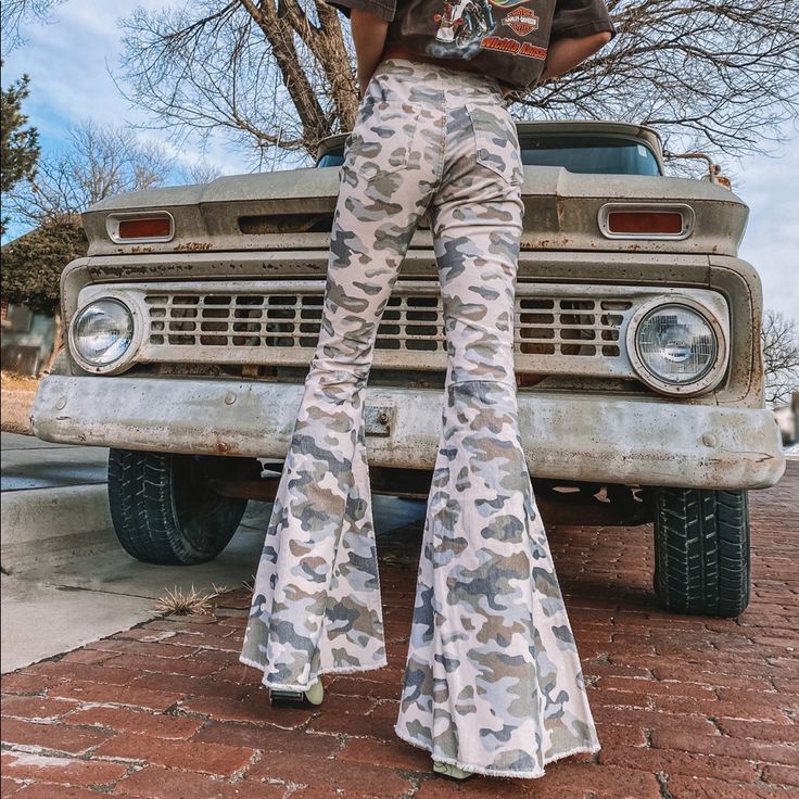 Tan Colored Corduroy Pants With Light; Olive Green, Blue, Navy And Brown Camouflage Pattern All Over. High Waisted With Frayed Bottom Hem. These Pants Look Adorable Paired With A Vintage Harley Davidson Tee From Our Vintage Section And A Pair Of Boots! 97% Cotton & 3% Spandex Model Is Size Small Wearing Size Small Measurements: S: Waist 26" - Hip 34" - Thighs 19" - Rise 10.5" - Inseam 32" - Length 43" M: Waist 28" - Hip 37" - Thighs 20" - Rise 11" - Inseam 32" - Length 43" L: Waist 30" - Hip 39" Cotton Camouflage Bottoms For Fall, Camouflage Cotton Bottoms For Fall, Fall Camouflage Cotton Bottoms, High Waist Camouflage Cotton Bottoms, Fall Camouflage Full Length Bottoms, Full Length Camouflage Bottoms For Fall, Spring Fitted Camouflage Bottoms, Camouflage Cotton Pants For Fall, Camouflage Full Length Pants For Fall