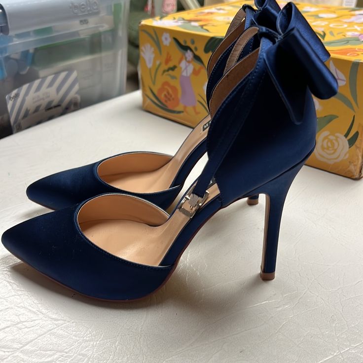 Navy Blue Bow Heels With Ankle Strap , New But Without Box And Tags, Never Worn Out Of The House, Only Tried On. They Didn’t Match Well With The Dress I Purchased To Wear Them With For A Wedding. Size 7 . Heel Height 4.5” Inches Navy Blue Quinceanera Shoes, Navy Blue And Gold Heels, Navy Wedding Shoes Bride, Midnight Blue Shoes, Navy Heels Wedding, Midnight Blue Heels, Heels With Blue Dress, Prom Heels Blue, Blue Ankle-high Heels With 4-inch Heel