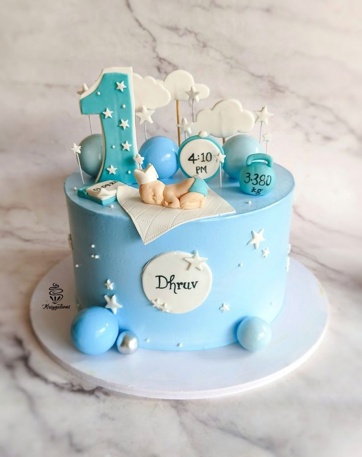 A first birthday cake for a baby boy in blue Cake Design For 1st Birthday Boy, Cake For First Birthday Boy, 1st Birthday Cake Designs For Boys, Birthday Cake For 1 Year Boy, Cake For 1st Birthday Boy, One Year Old Birthday Cake Boy, Boys Cake Design, First Birthday Cakes For Boys, 1 Year Baby Boy Birthday Cake Ideas