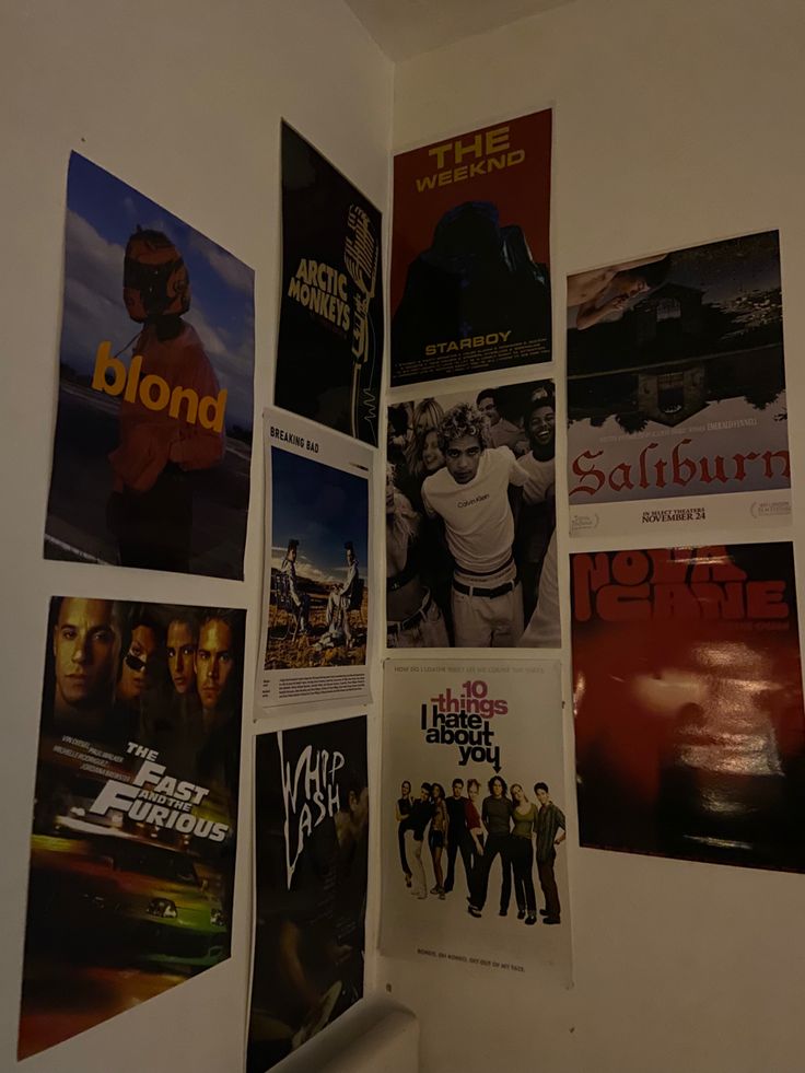 several movie posters are hanging on the wall