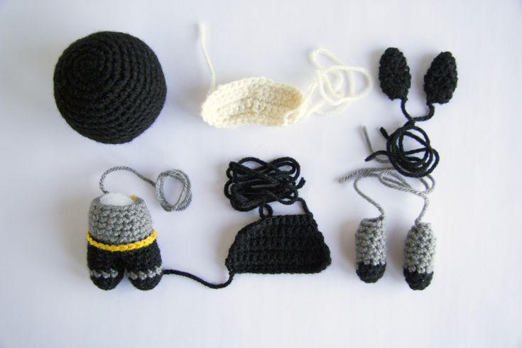 crocheted items are displayed on a white surface