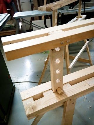 a wooden bench being built in a shop