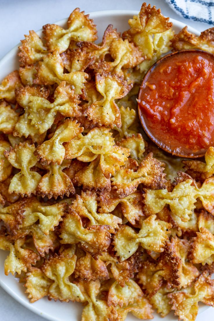 a white plate topped with pasta and sauce