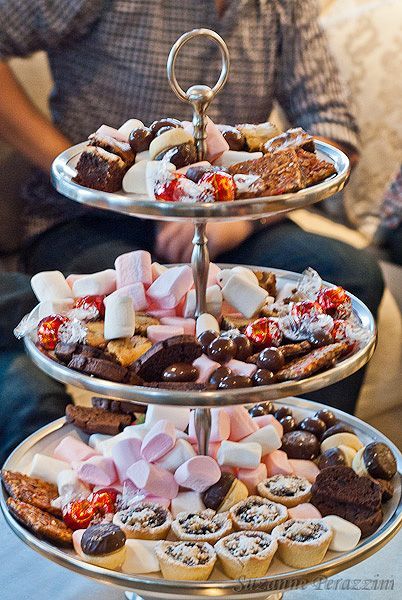 three tiered trays filled with assorted pastries