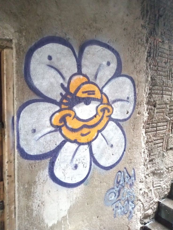 a flower painted on the side of a building