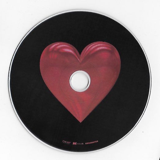 a cd disc with a red heart on it