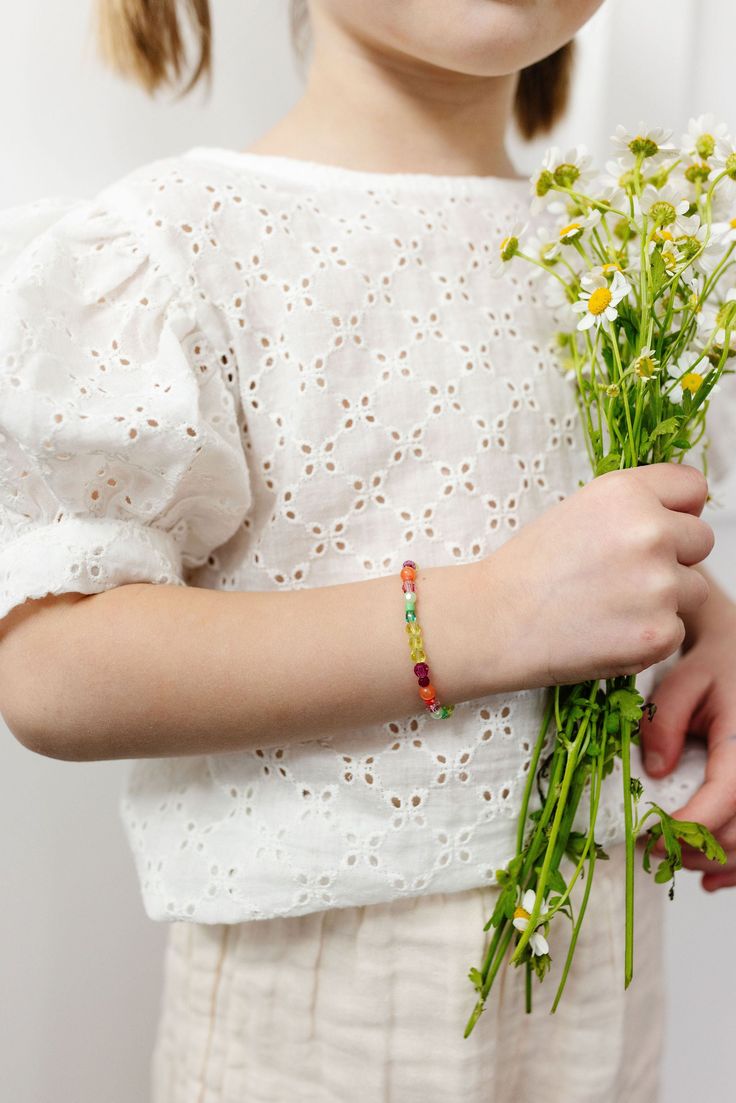 Let's vibe with this beautiful mix! These fun and vibrant colors are sure to be an eye catcher. From the deep magenta to the soft light green. This bracelet is sure to be a bold statement with your everyday pieces. The perfect accessory for every little girl! Made with the highest quality materials, this bracelet will look beautiful for years to come. Durable enough for play, precious enough to keep forever. Materials: 14k gold filled or sterling silver components. Nickel free. To learn more abo Green Tiny Beads Friendship Bracelets, Playful Green Stretch Bracelet As Gift, Playful Handmade Green Stretch Bracelet, Playful Green Handmade Stretch Bracelet, Green Tiny Beads Friendship Bracelets For Summer, Handmade Green Playful Friendship Bracelets, Playful Handmade Green Friendship Bracelets, Multicolor Bohemian Bracelet For Spring, Adjustable Green Playful Bracelets