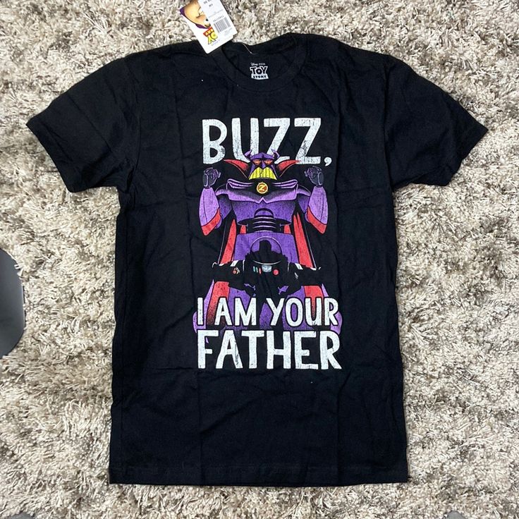 Toy Story Buzz And Zurg I Am Your Father Tee Shirt 100% Cotton Novelty Black T-shirt With Character Print, Funny Black Tops With Character Print, Black Novelty Shirt With Graphic Print, Black Pop Culture Top With Text Print, Black Text Print Pop Culture Top, Black Pop Culture Text Print Top, Black Pre-shrunk Shirt For Fan Conventions, Black Short Sleeve Fandom Top, Novelty Black Shirt With Funny Print