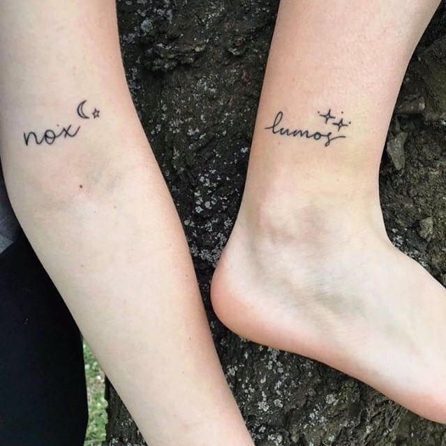 two people with tattoos on their legs that say, nox and lunat next to each other