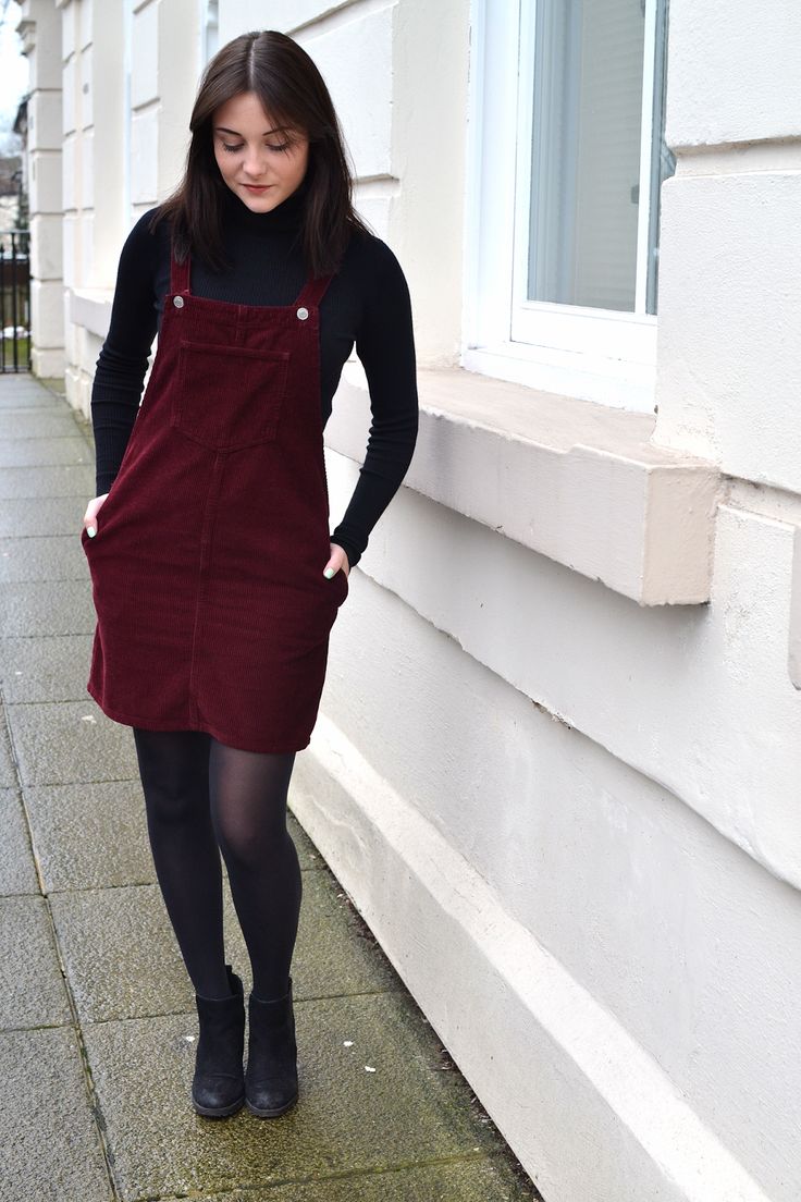 ktcrossthwaite: FASHION: THE LITTLE BURGUNDY DRESS Jumper Dress With Tights, Corduroy Jumper Dress Outfit, Corduroy Pinafore Dress Outfit, Overalls Dress Outfit Fall, How To Style Overall Dress, Burgundy Overalls Outfit, How To Style Stockings With Dress, Dress With T Shirt Under, Corduroy Overall Dress Outfit Fall