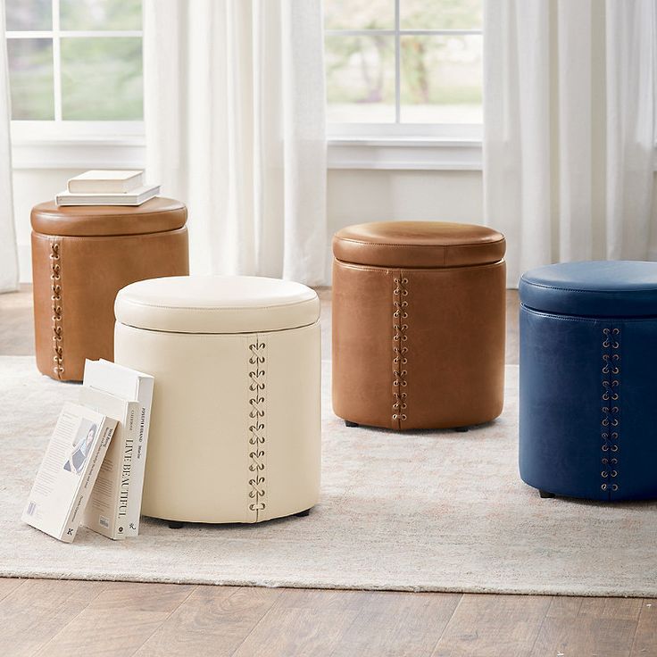 three stools sitting on top of a rug in front of a window