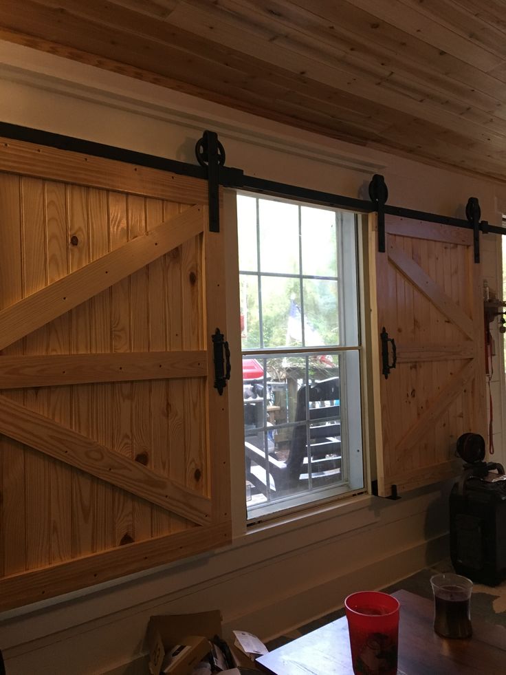 the interior of a restaurant with sliding barn doors