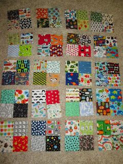 the quilt is laid out on the floor