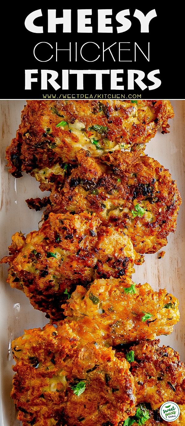 chicken fritters on a white plate with parsley in the middle and text that reads cheesy chicken fritters