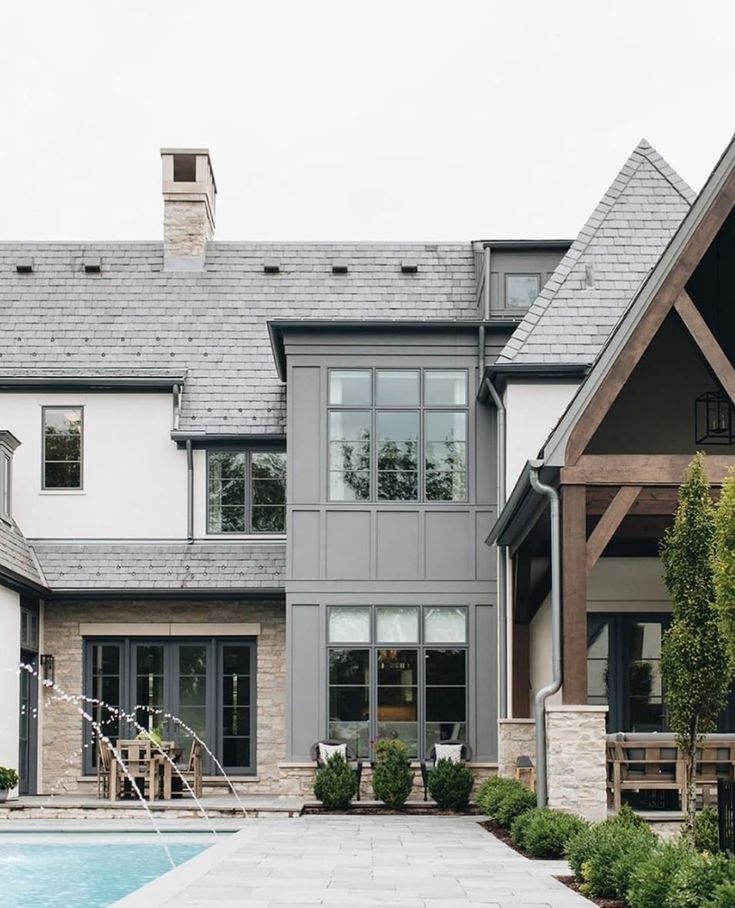 a house with a pool in front of it and an instagram post about the home