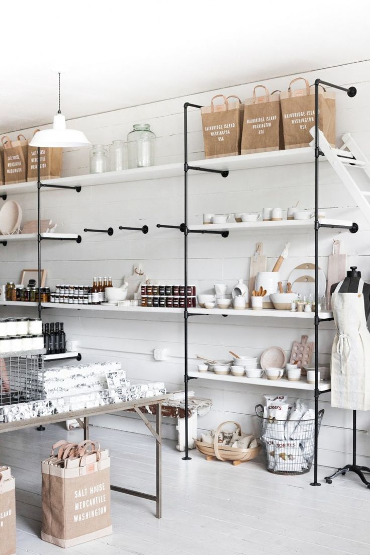 the interior of a store with shelves and baskets