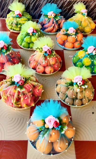 several baskets filled with fruit sitting on top of a table