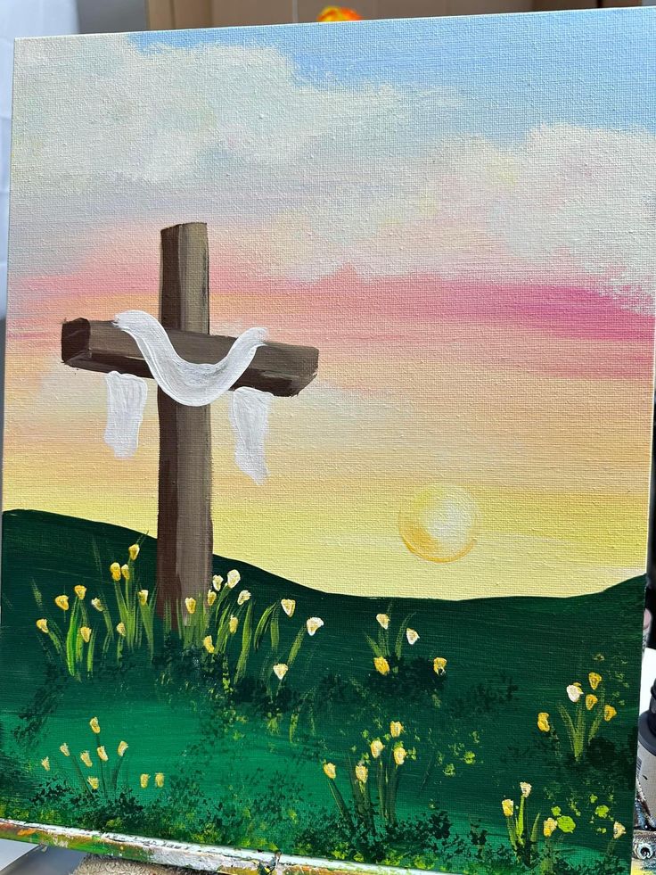 a painting of a cross in the middle of a field