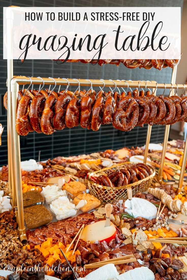 a table filled with lots of different types of sausages and other foods on it