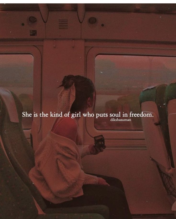 a woman sitting on a train looking out the window with an inspirational quote above her