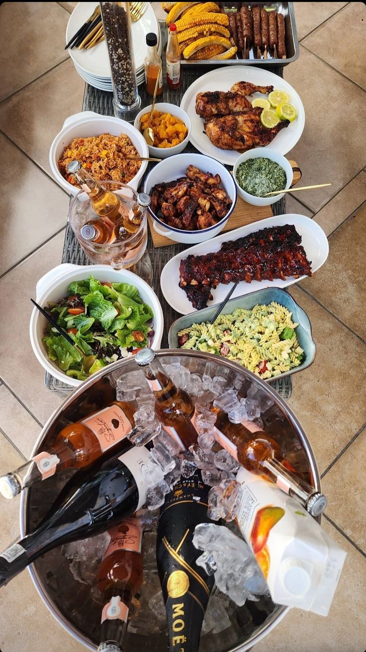 a table full of different types of food and drinks on it's trays