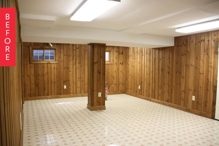 an empty room with wood paneling on the walls and floor is shown in this image