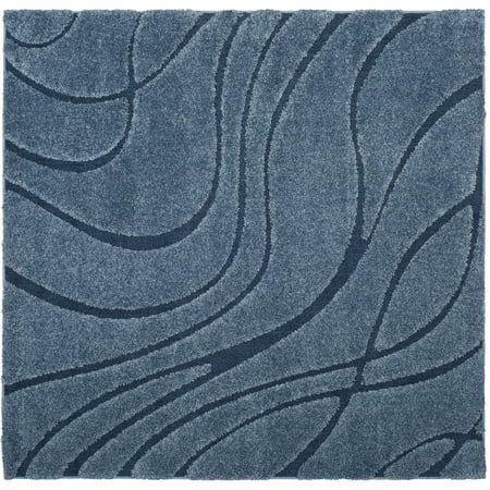 a blue rug with wavy lines on it