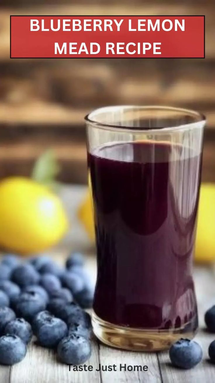 blueberry lemon mead recipe in a glass next to fresh blueberries