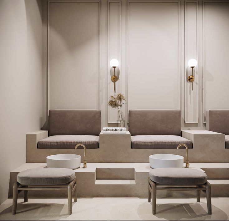 the interior of a salon with benches, stools and mirrors on the wall next to each other