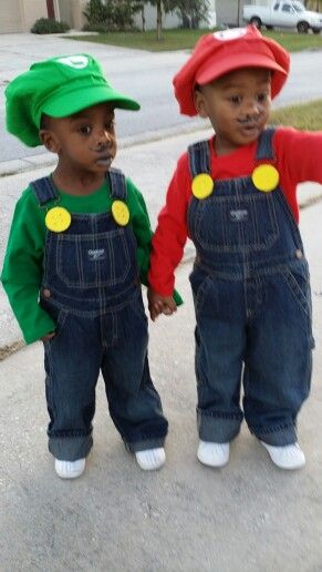 two little boys dressed up like mario and luigi