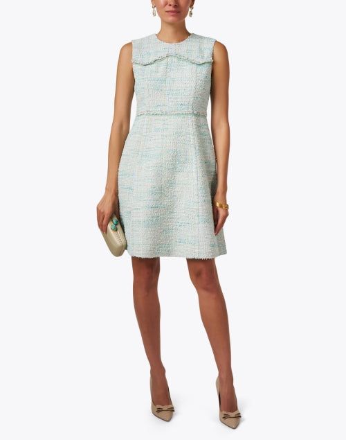 St. John is known for their commitment to classic American luxury, and this dress does not disappoint. Crafted from light green tweed it features a fit and flare silhouette and is super flattering. Wear it with heels and the brand's coordinating cropped jacket for a chic look. Spring A-line Tweed Dress, Spring Formal A-line Tweed Dress, Tailored Tweed Dress For Spring, Elegant Fitted Green Tweed Dress, Green Tweed Dress For Work, Chic Green Fitted Tweed Dress, Chic Green Tweed Dress For Spring, Skirt And Top Dress, Green Tweed