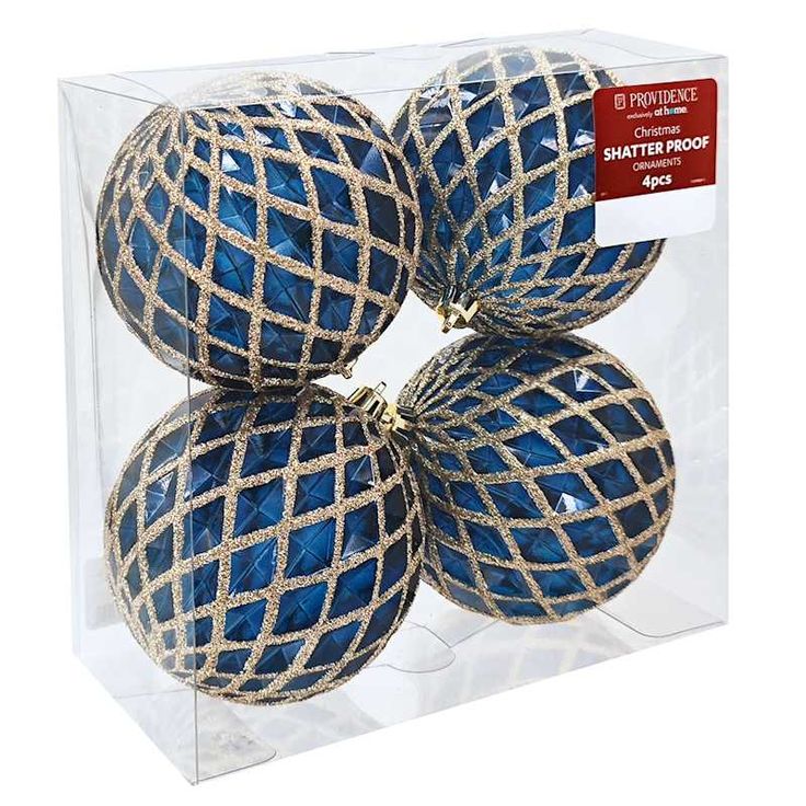 four blue christmas balls in a clear box