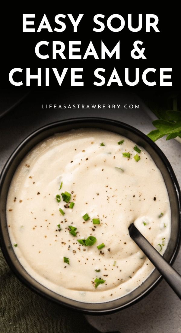 a bowl filled with creamy cream and chive sauce