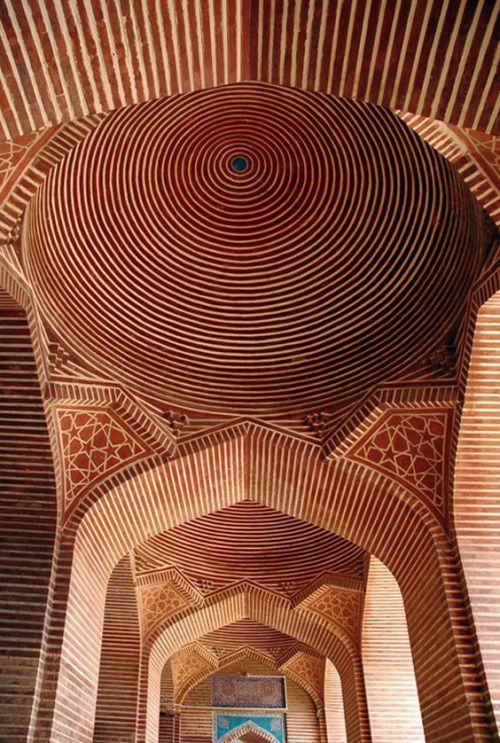 the inside of an ornate building with arches