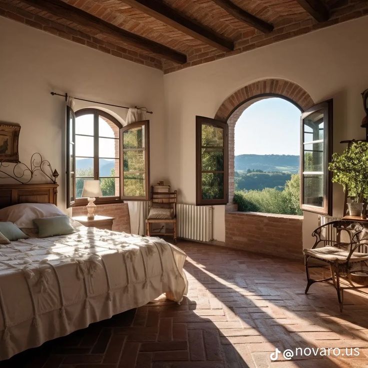 a bed sitting in a bedroom next to two windows